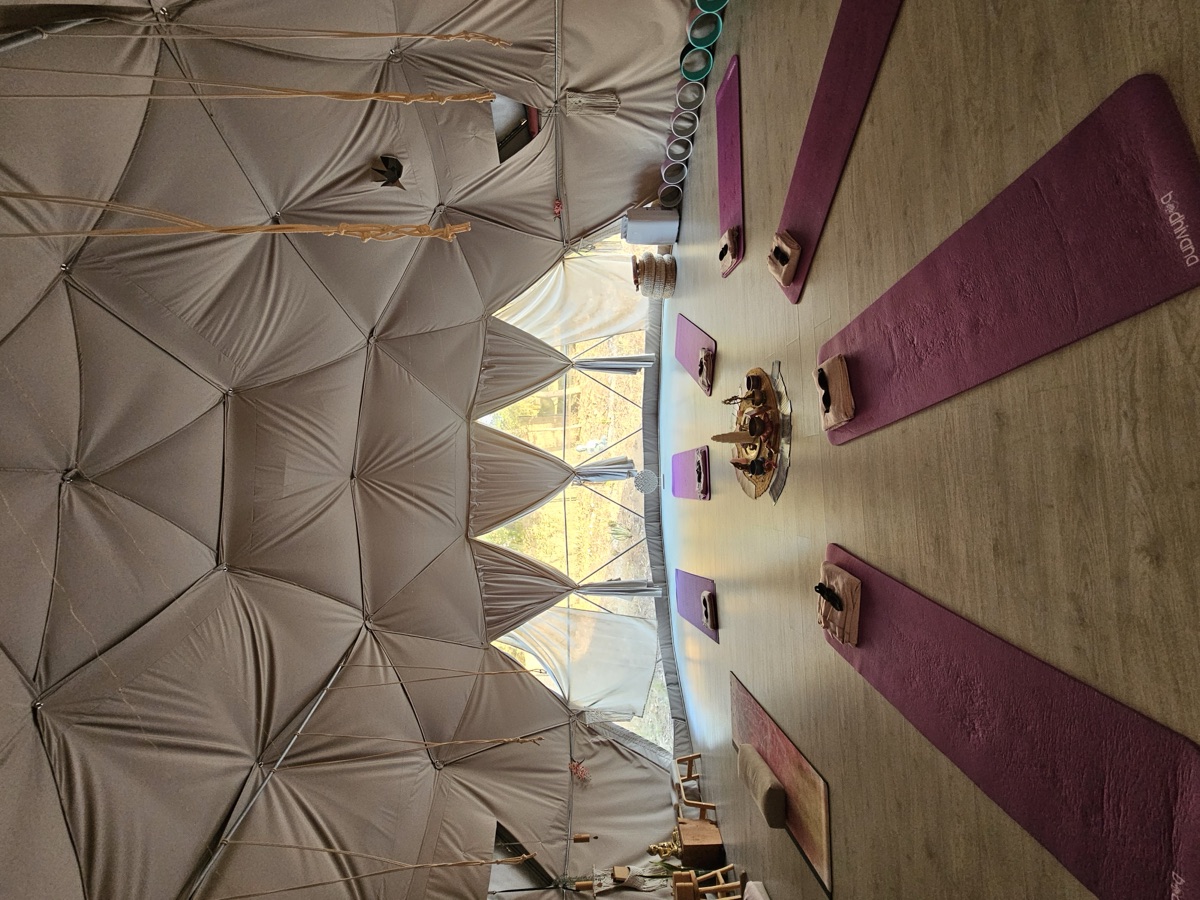 Yoga mats and blankets prepared inside a geodesic dome
